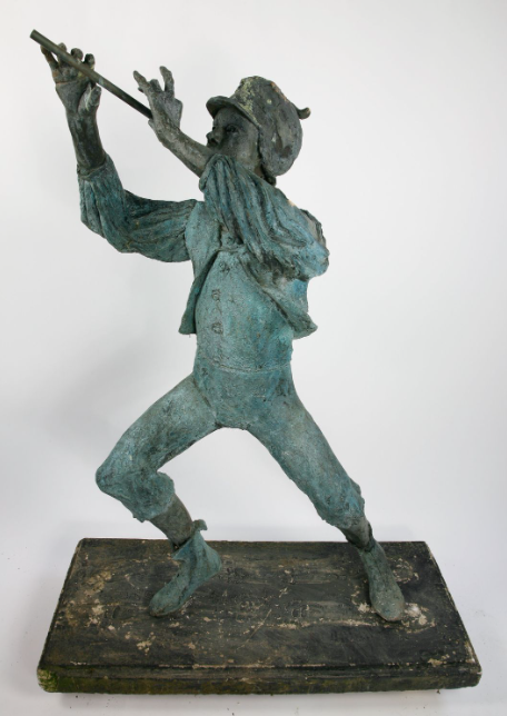 A bronze piper